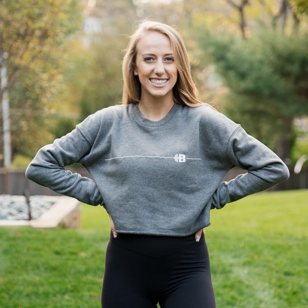 Brittany Lynne Fitness Cropped Long Sleeve from the front with hands on hips